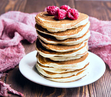 delicious pancakes on wooden table with fruitsの写真素材