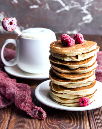 delicious pancakes on wooden table with fruitsの写真素材