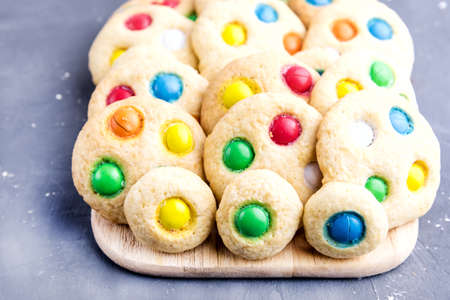 Homemade cookies with colorful chocolate candiesの写真素材