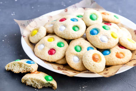 Homemade cookies with colorful chocolate candiesの写真素材