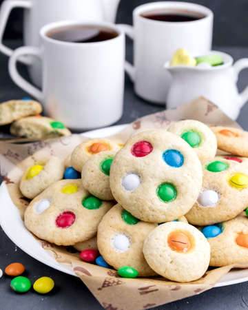 Homemade cookies with colorful chocolate candiesの写真素材