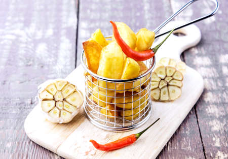 Roasted potato served in basket Garlic Pepperの写真素材