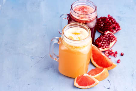 Pomegranate and citrus fresh juice Slice of fresh fruitの写真素材