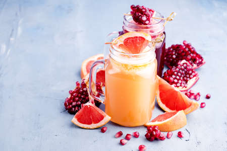 Pomegranate and citrus fresh juice Slice of fresh fruitの写真素材