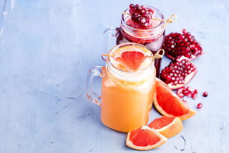 Pomegranate and citrus fresh juice Slice of fresh fruitの写真素材