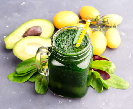 Avocado Spinach smoothie Vegetables around glassの写真素材