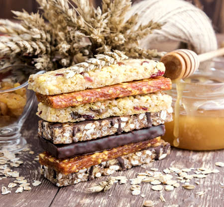 Granola Dried apricot bars Apple Wooden backgroundの写真素材