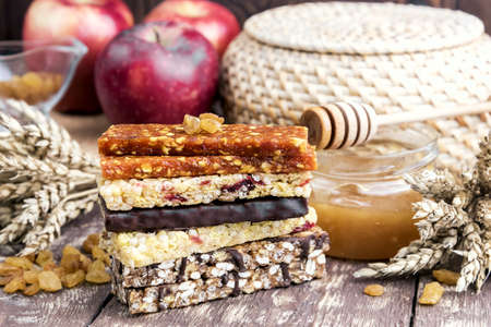 Granola Dried apricot bars Apple Wooden backgroundの写真素材