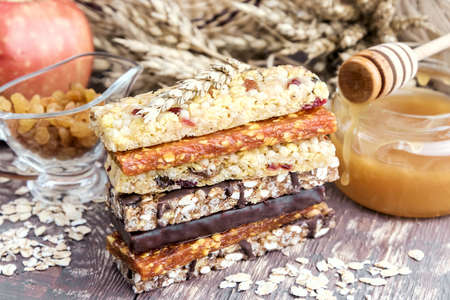 Granola Dried apricot bars Apple Wooden backgroundの写真素材