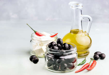 Bottle with olive oil Cheese in jarの写真素材