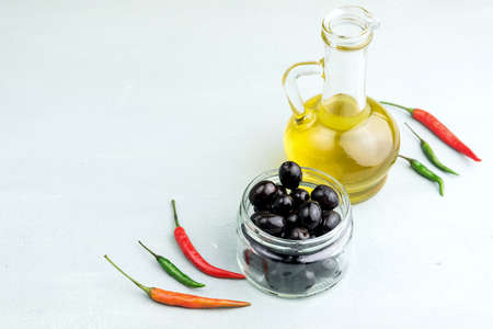 Bottle with olive oil Cheese in jarの写真素材