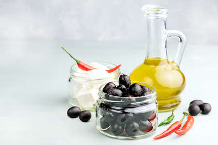 Bottle with olive oil Cheese in jarの写真素材