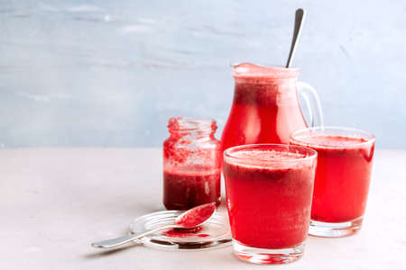 Two glasses with berries lemonadeの写真素材