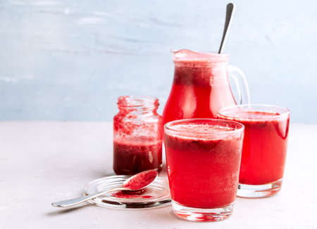 Two glasses with berries lemonadeの写真素材