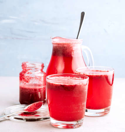 Two glasses with berries lemonadeの写真素材