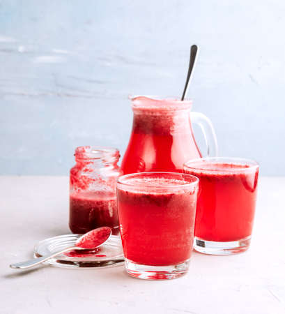 Two glasses with berries lemonadeの写真素材
