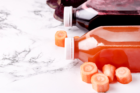 Beetroot Carrots Orange Green Apple Healthy Juice Detox Juice in Bottle Healthy Diet Food Copy Spaceの写真素材