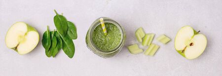 Glass Jar of Healthy Green Smoothie Detox Drink wirh Green Apple Celery and Raw Spinach Diet Beverage Longの写真素材
