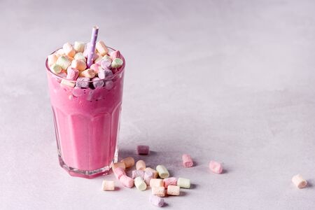 Glass of Tasty Fruit Smoothies or Milk Shake Decorated With Marshmallow Horizontal Copy Spaceの写真素材