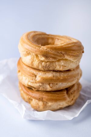 Stack Of Tasty Home Baking Eclair with Cottage Cheese Tasty Homemade Dessert Blue Backgroundの写真素材