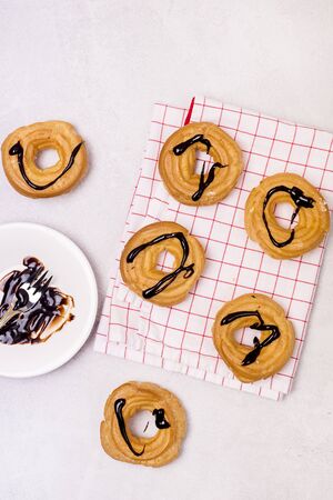 Tasty Home Baking Eclair with Cottage Cheese and Chocolate Sauce Tasty Homemade Dessert Top View Flat Lay Verticalの写真素材