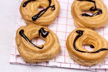 Tasty Home Baking Eclair with Cottage Cheese and Chocolate Sauce Tasty Homemade Dessert Top View Flat Lay Horizontal Close Upの写真素材