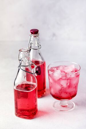 Bottles of Tasty Pink Berry Lemonade Juice Cocktail Tasty Beverage Verticalの写真素材