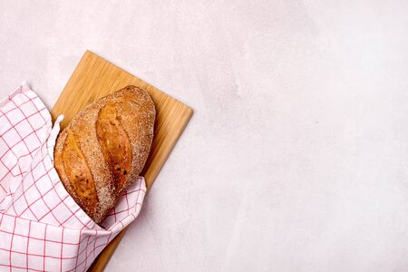 Tasty Homemade Bread on Wooden Board Light Gray Background Top View Copy Spaceの写真素材