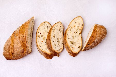 Tasty Homemade Bread on Wooden Board Light Gray Background Top View Horizontalの写真素材