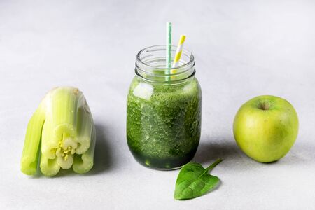 Glass Jar of Healthy Green Smoothie Detox Drink wirh Green Apple Celery and Raw Spinach Diet Beverage Horizontalの写真素材