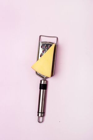 Grater Parmesane Cheese Pink Background Vertical Top Viewの写真素材