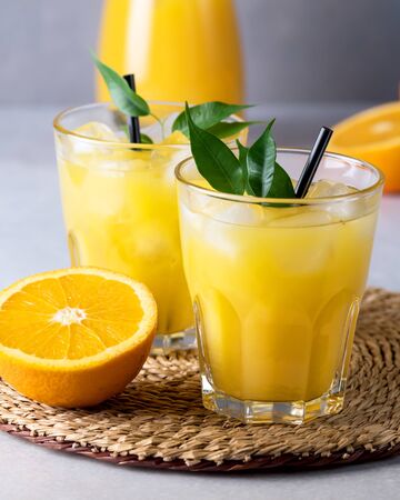 Two Gasses of Tasty Orange Juice Tasty Summer Citrus Drink Ripe Orangesの写真素材