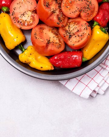 Roast Peppers and Tomatoes on Black Plate Grilled Vegetables on Plate Top View Copy Spaceの写真素材