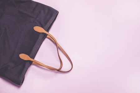 Fashion or Shopping Concept Brown Textile Woman Bag on Pink Background Horizontal Copy Spaceの写真素材