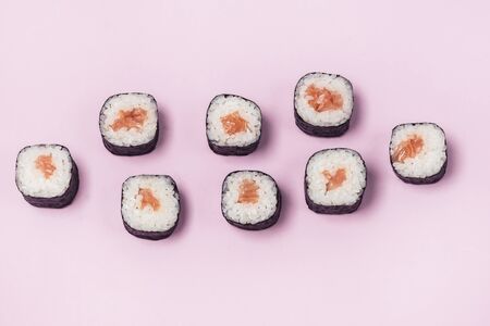 Fresh Made Sushi set with Salmon on Pink Background Japanese Food Sushi Top View Horizontalの写真素材