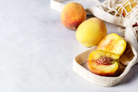 Eco Bag with Tropical Fruit Peach Tasty Fruits Horizontal Copy Spaceの写真素材