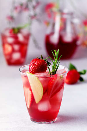 Glasses of Fresh and Cold Strawbery and Green Apple Lemonade Tasty and Healthy Summer Drink Cold Berry and Fruit Lemonade Vertical Close Upの写真素材