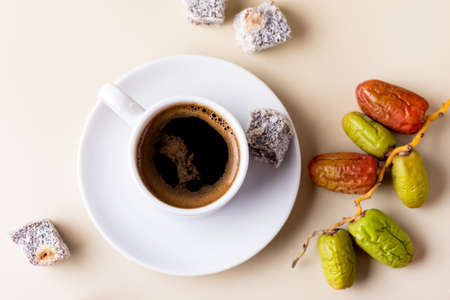 Turkish Delight Lokum and Cup of Turkish Coffee on Yellow Background Tasty Eastern Sweets Dessert Horizontalの写真素材