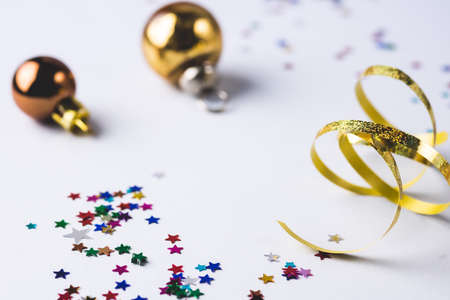 Christmas or New Year Background with Gold Christmas Balls and Confetti and Ribbon Blue Background Vertical Festiveの写真素材