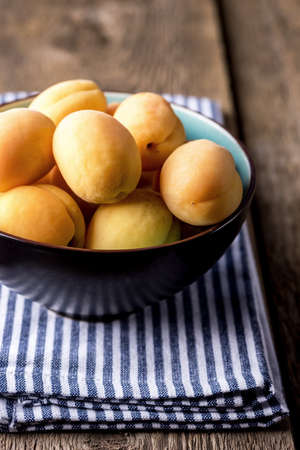Raw Organic Apricots in a Bowlの写真素材