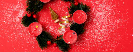 Nice Advent Wreath Red Candles Golden Christmas Ornaments on Red Background Snow Holiday Minimal...