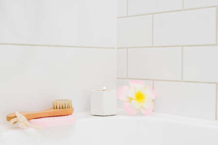 White Background Bath Candle Plumeria Flower Bamboo Face Brush SPA at Home Concept Horizontalの写真素材