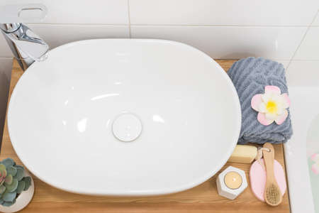 Bathroom Sink Counter Gray Towel Candle Soap Bamboo Face Brush Top Viewの写真素材