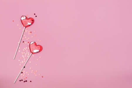 Two Lollipops Hearts Red Confetti Candy Love Concept Valentine Day Copy Space Top Viewの写真素材
