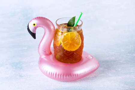 Summer Beach composition Inflatable Mini flamingo with Cold Drink on Pastel blue background Pool Float Party Trendy Concept Flat lay Horizontalの写真素材