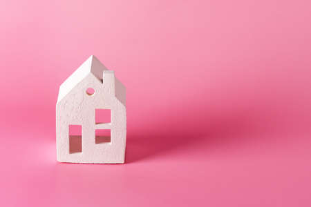 Miniature white toy house on pink pastel background Trendy Background Property Insurance dream home concept copy spaceの写真素材