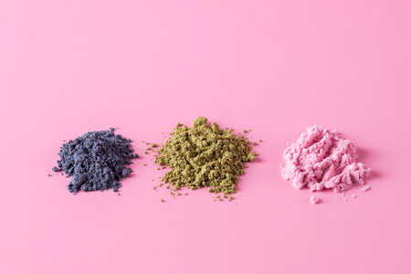 Heap of Blue and Green and Pink Matcha Powder on Pink Background Top View Horizontal