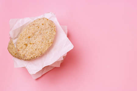 Stack of Raw Frozen Minced Meat Balls or Cutlets on Pink Background Selective Focus Homemade Cutlets for Cooking Top view Copy Spaceの写真素材