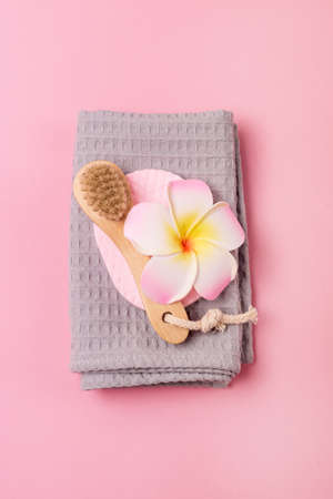 Face Brush made of Bamboo with Gray Towel Pink Background SPA no Plastic Concept Minimalism Verticalの写真素材