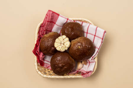 Traditional Ukrainian Homemade Garlic Buns Pampushki with Oil and Coriander Yellow Background Horizontalの写真素材